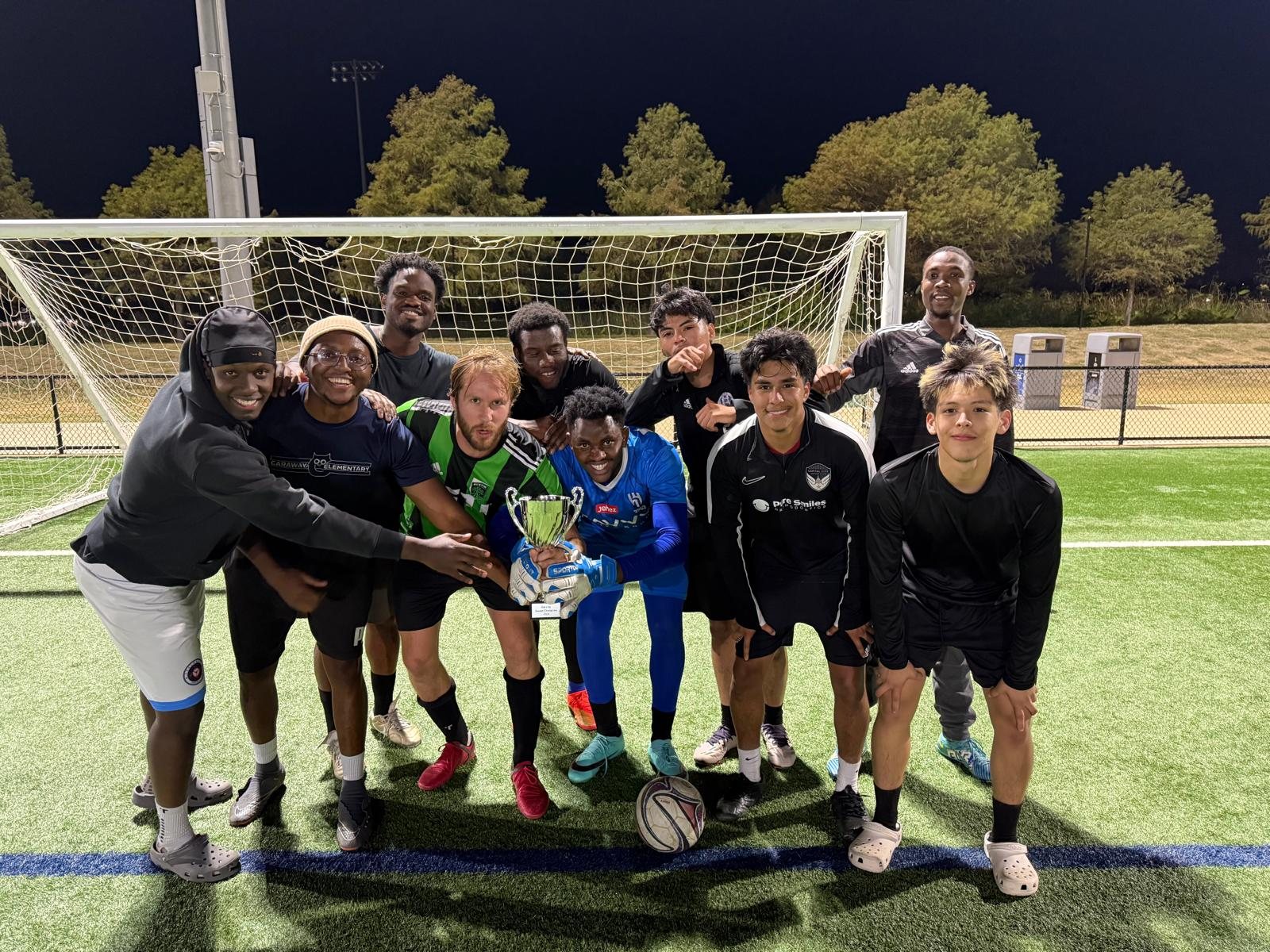 Merit SC squad celebrating with the trophy